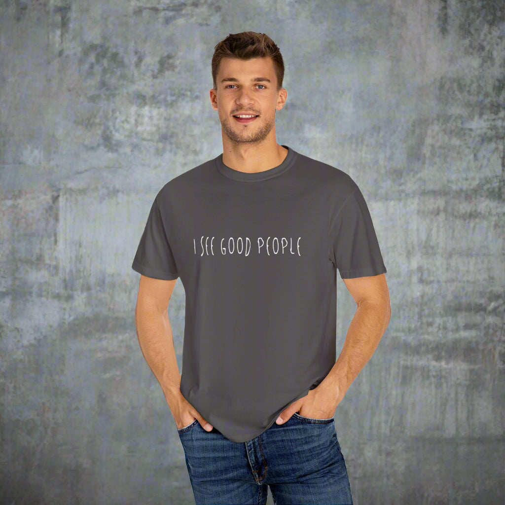 A mockup featuring a man wearing a gray 'I See Good People' unisex t-shirt. The minimalist white text design on the garment-dyed fabric emphasizes the shirt's relaxed fit and casual style, perfect for promoting positivity and good vibes.